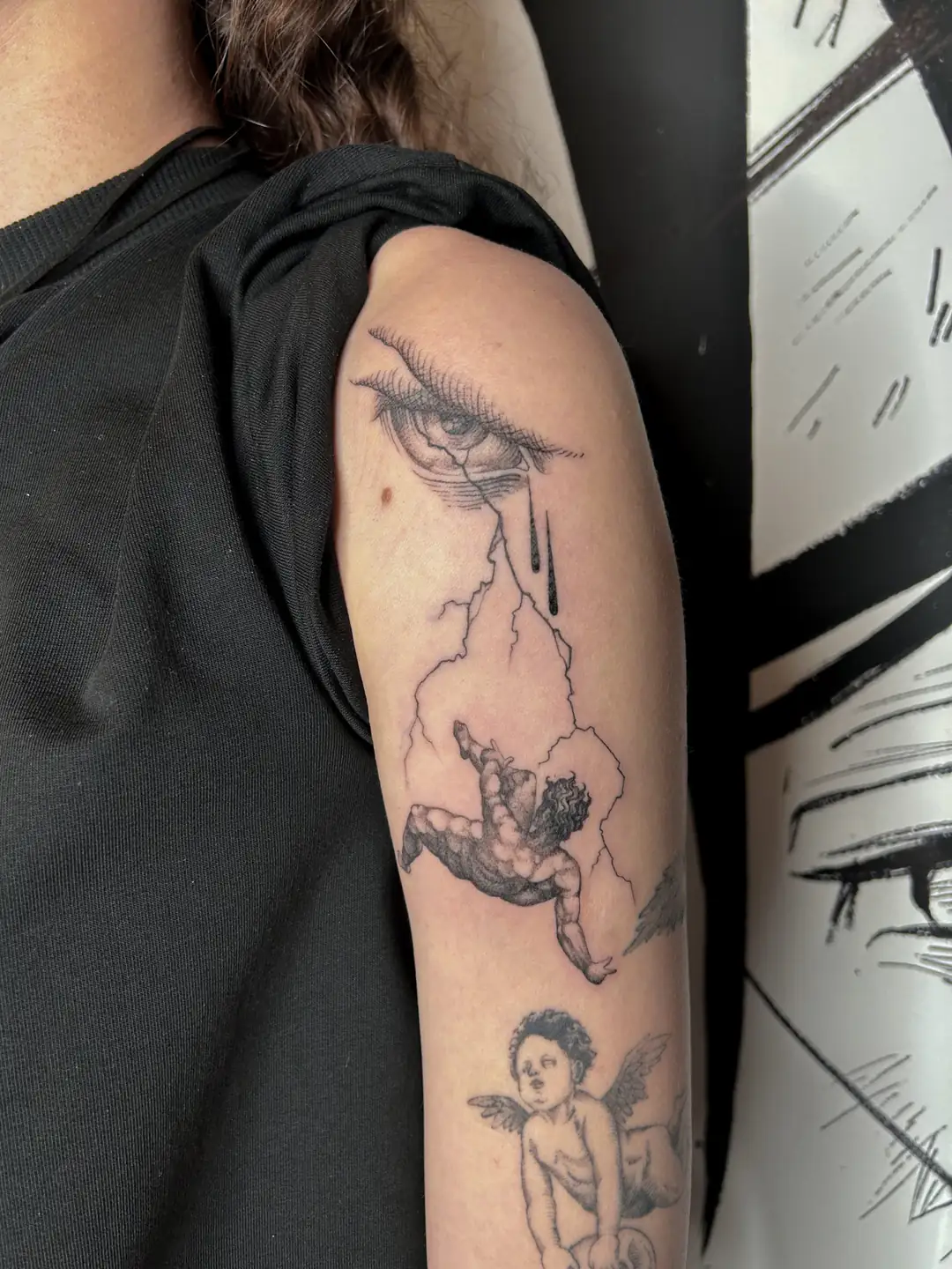 Eye, hands and angels on the arm. Tattoo at Ink21 in Vienna.