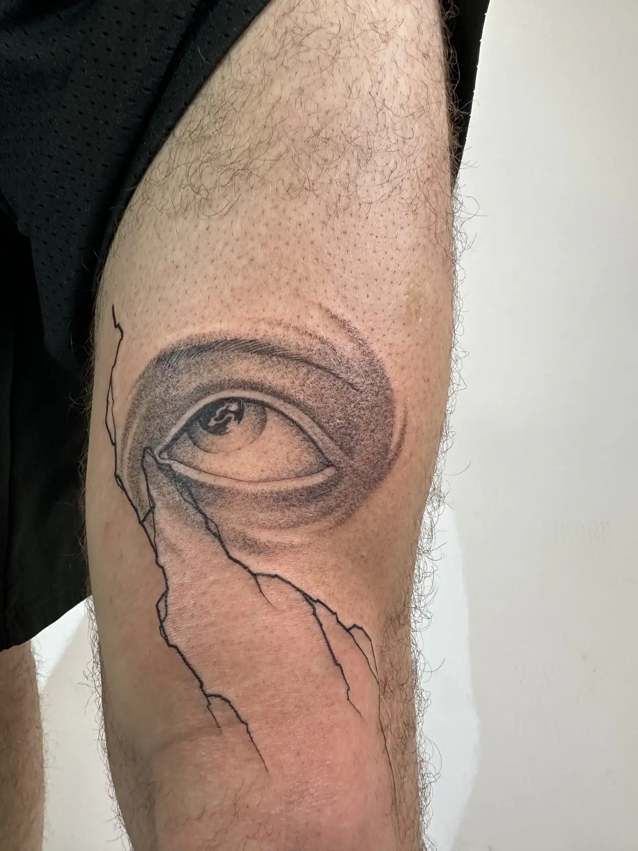 Eye with fine crack lines. Tattoo at Ink21 in Vienna.