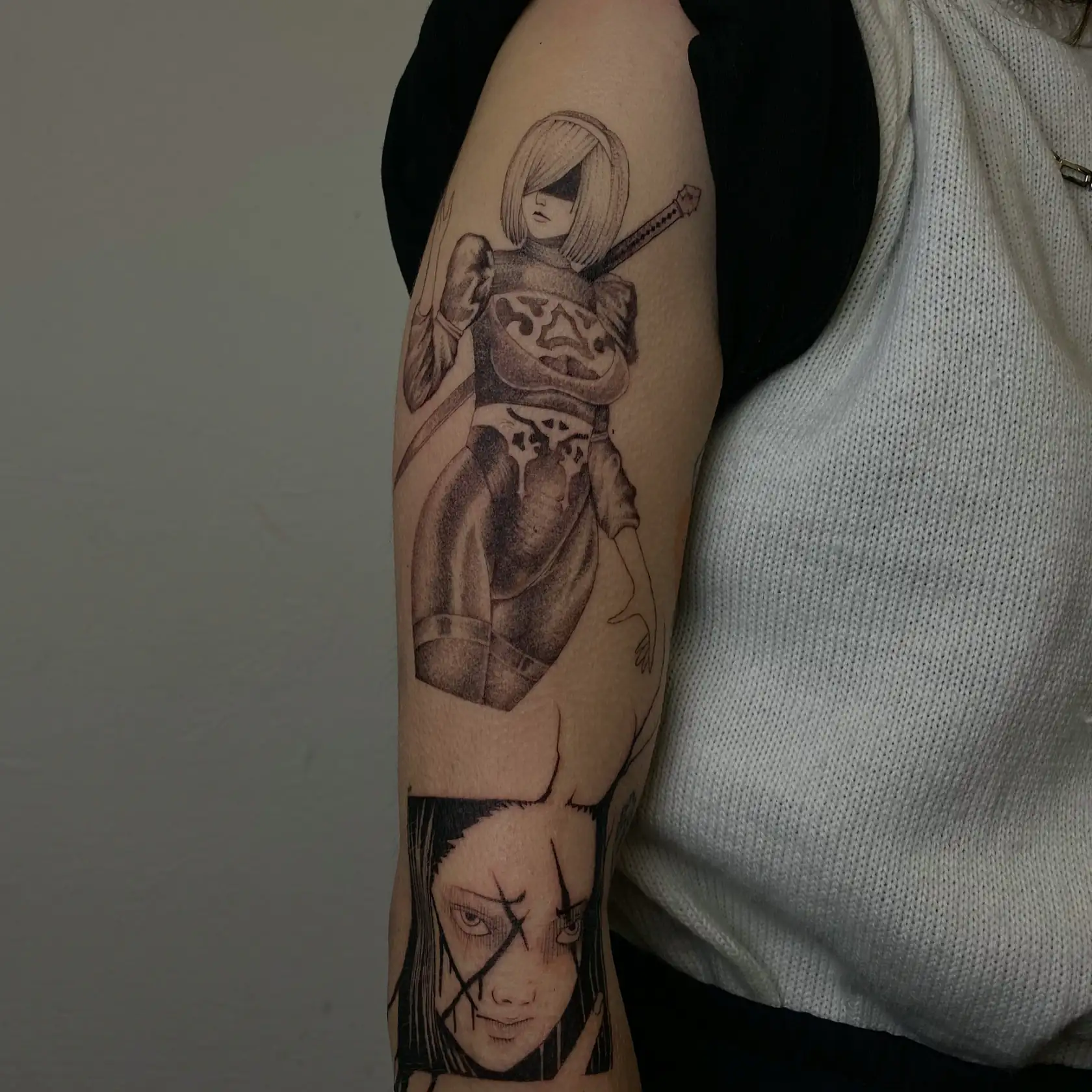 Figures and anatomical heart on the arm. Tattoo at Ink21 in Vienna.
