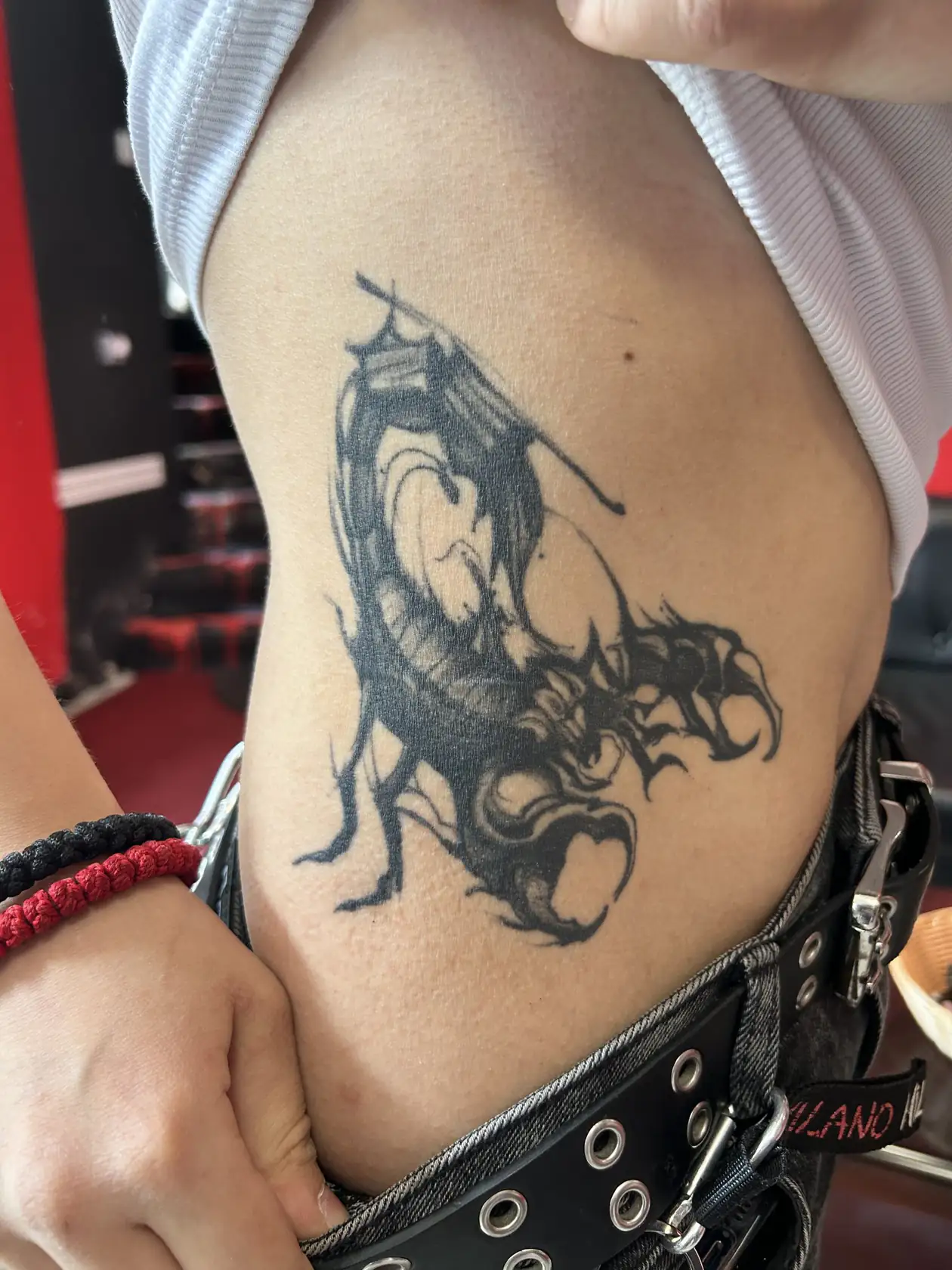 Curving dragon on the hip. Tattoo at Ink21 in Vienna.