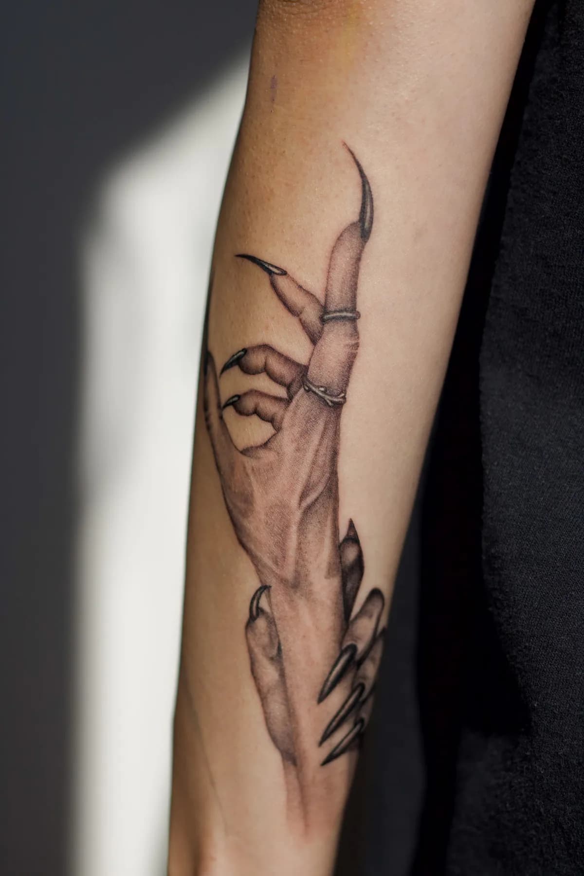 Hand with long pointed fingers. Tattoo at Ink21 in Vienna.