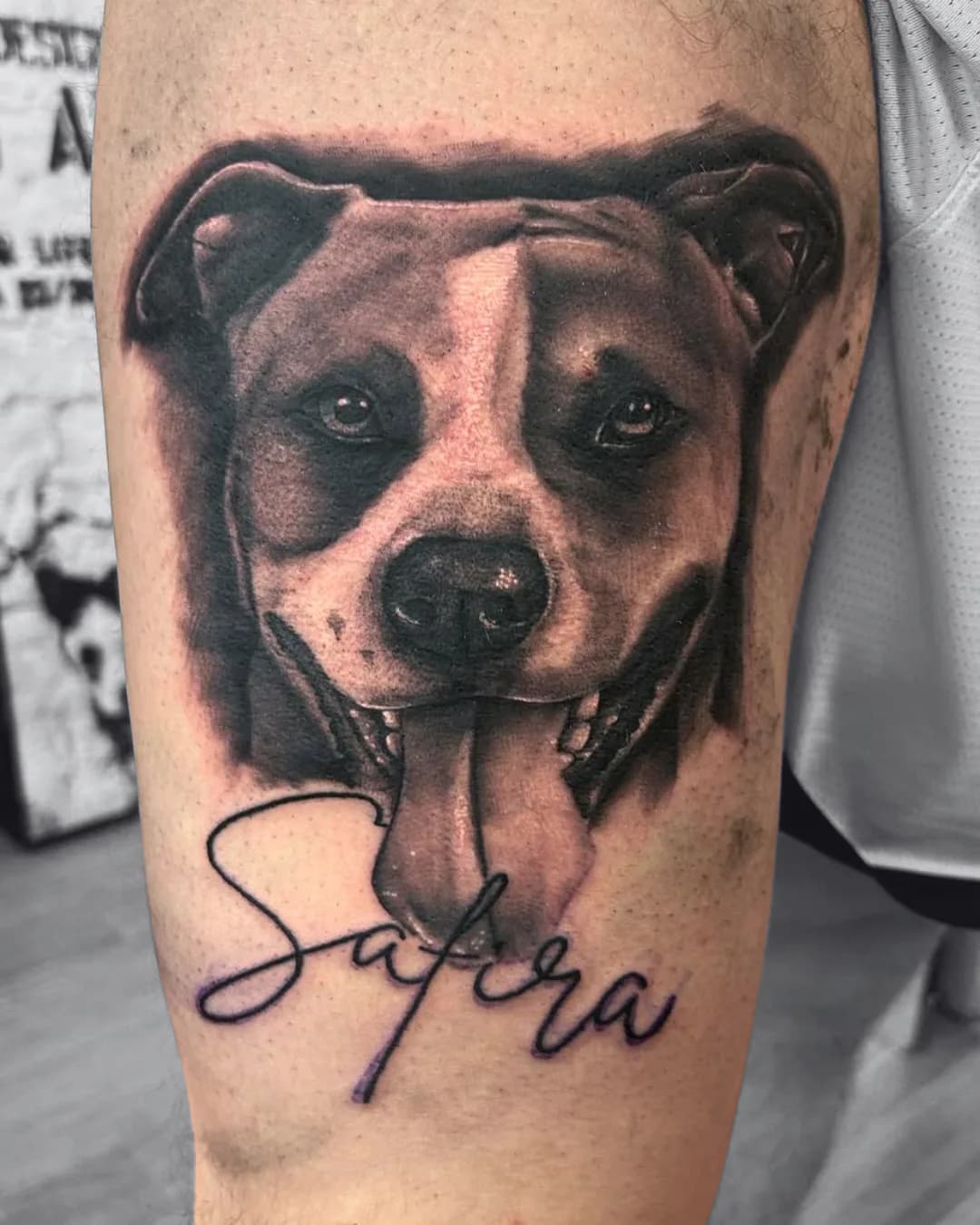 Dog portrait with its tongue out. Tattoo at Ink21 in Vienna.