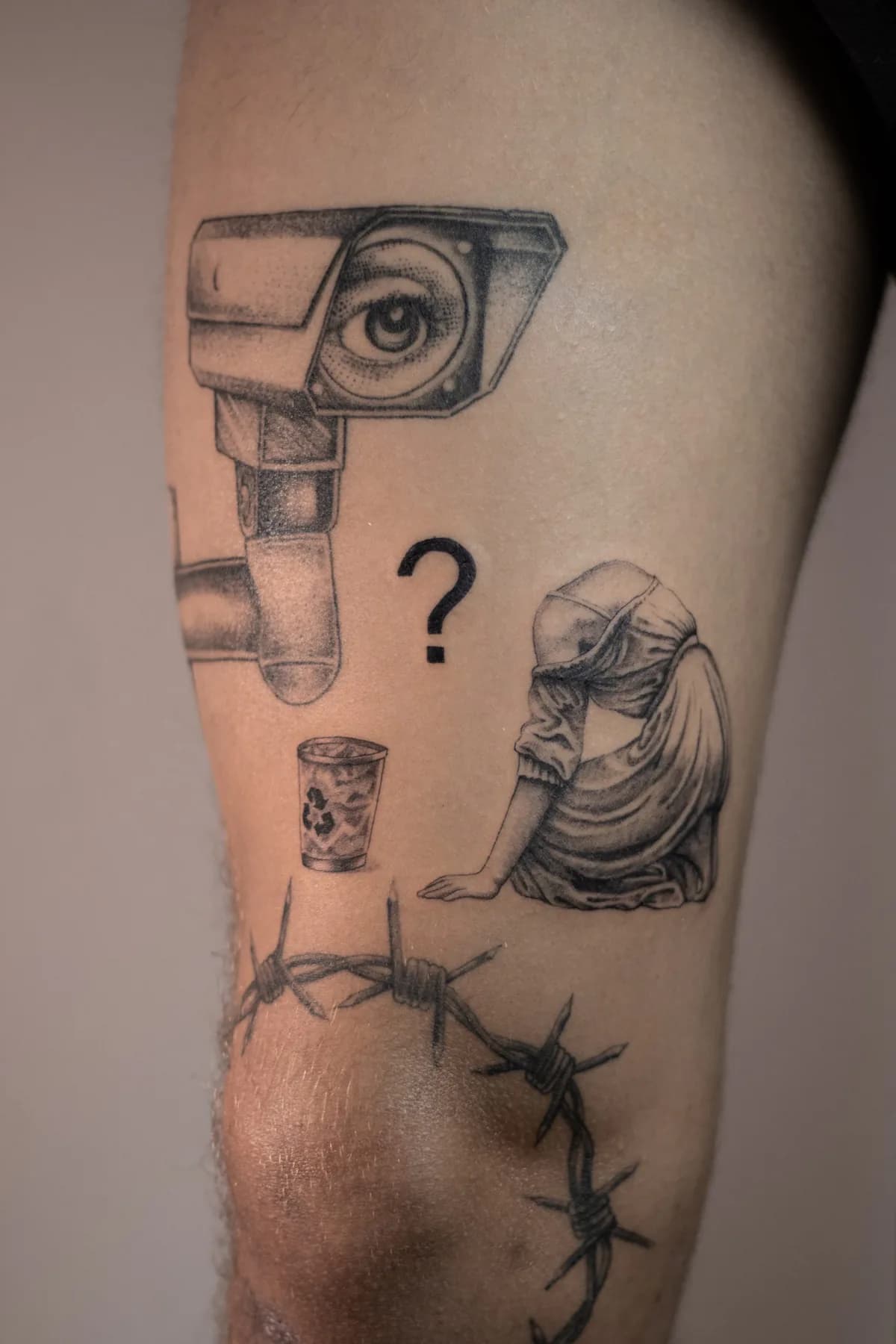 Camera with an eye and a dark figure. Tattoo at Ink21 in Vienna.