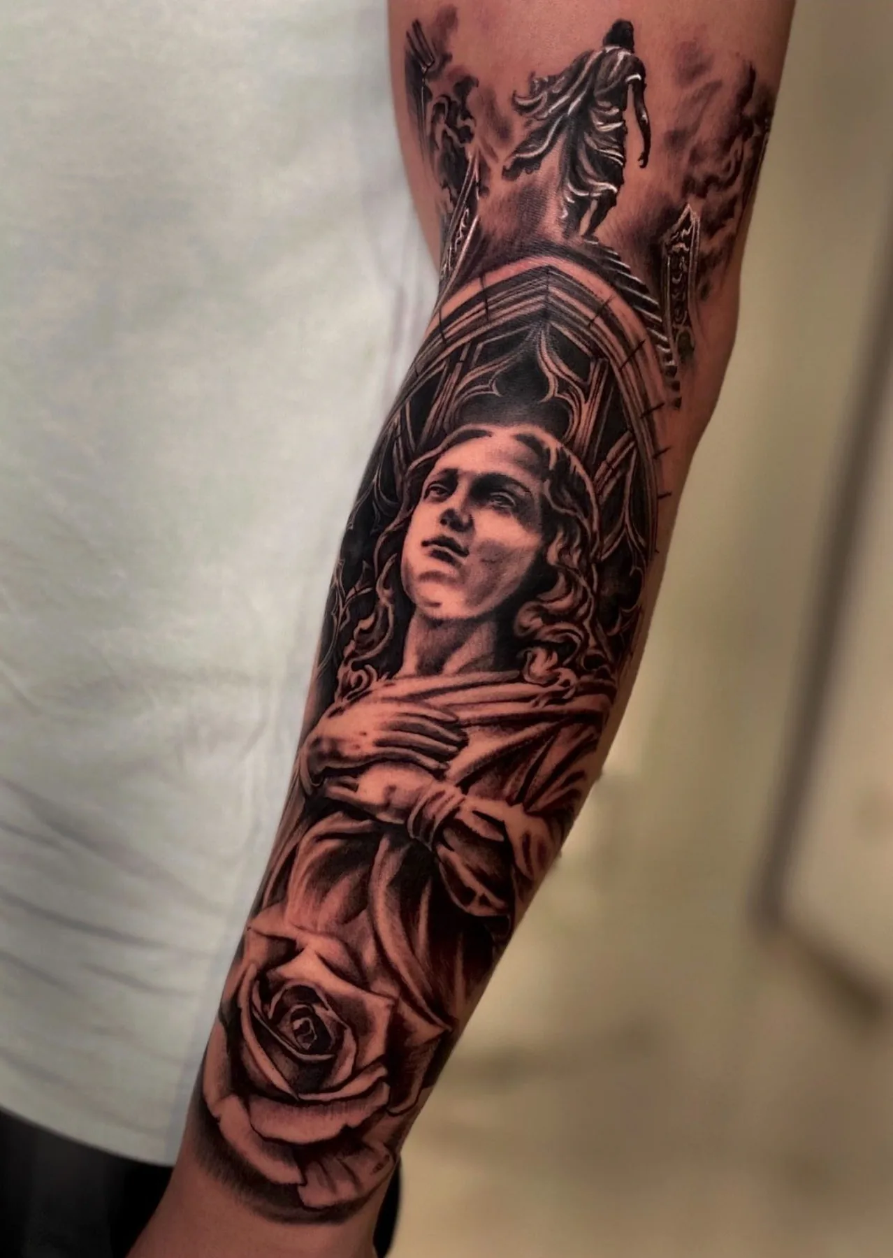 Classical figure between horses and a rose. Tattoo at Ink21 in Vienna.