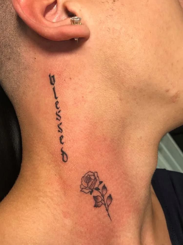 Blessed lettering and a neck rose. Tattoo at Ink21 in Vienna.