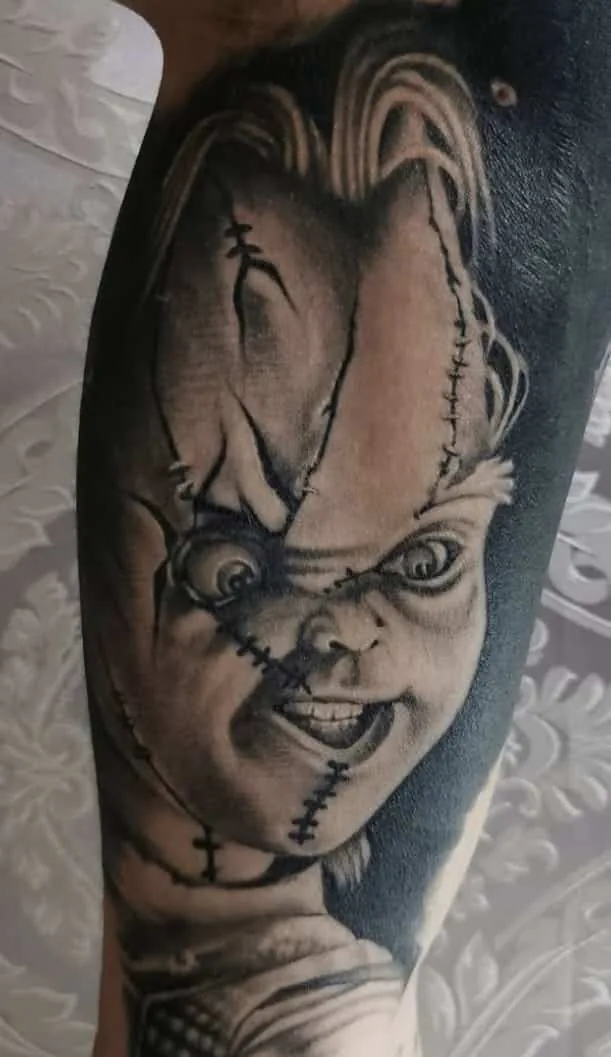 Chucky portrait with facial stitches. Tattoo at Ink21 in Vienna.