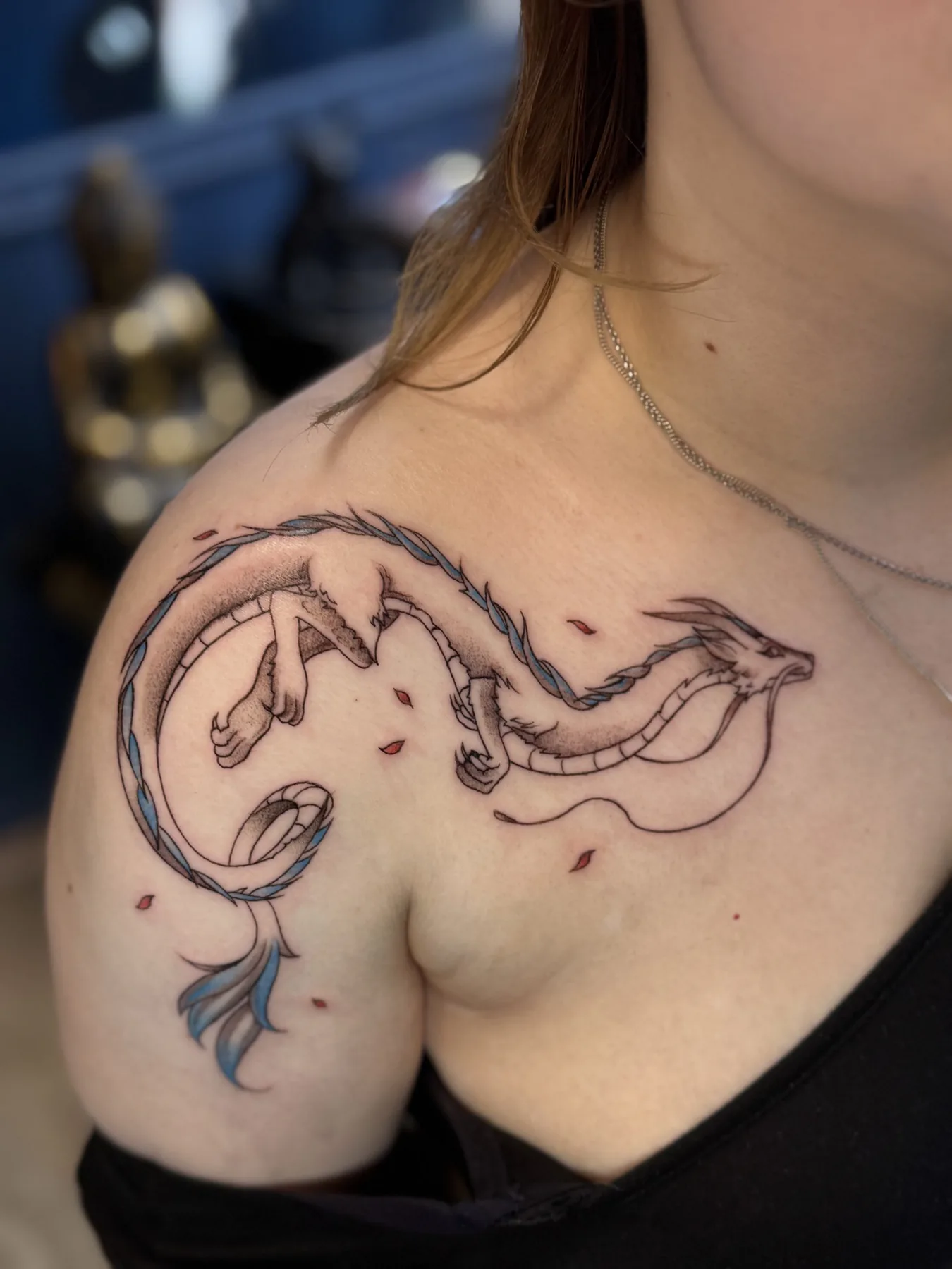 Slender dragon on the shoulder. Tattoo at Ink21 in Vienna.