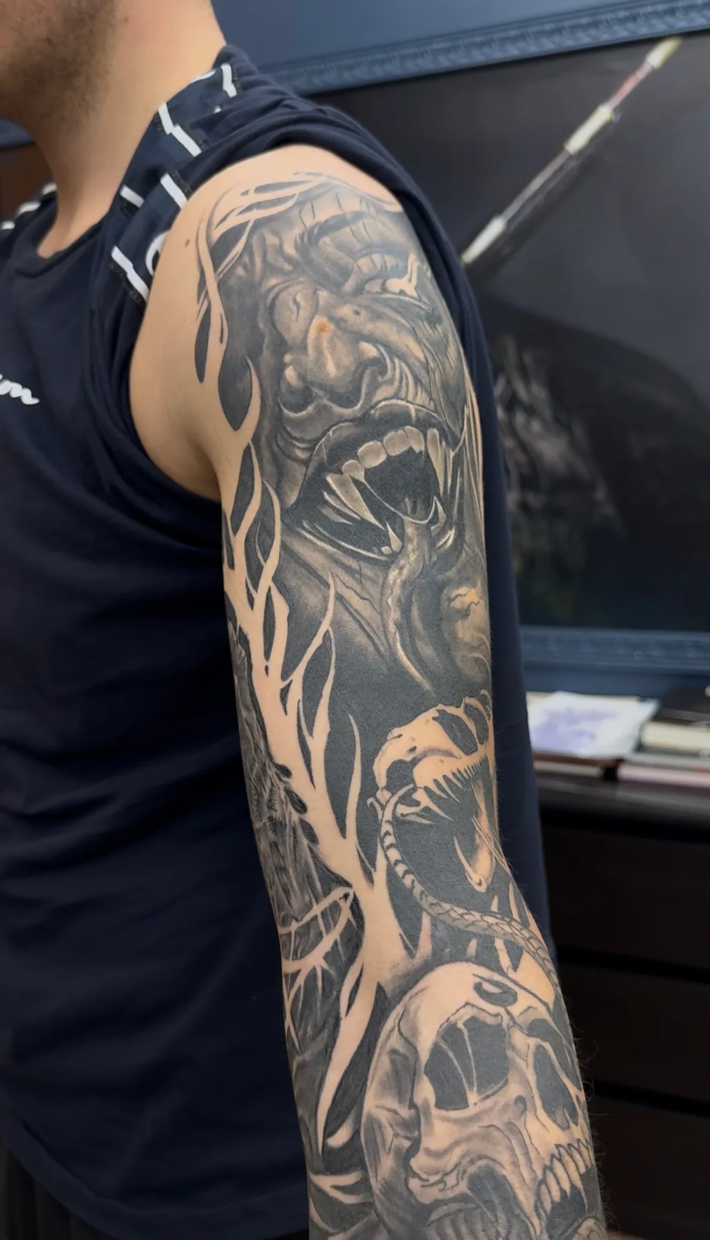 Dark skull sleeve from the side. Tattoo at Ink21 in Vienna.