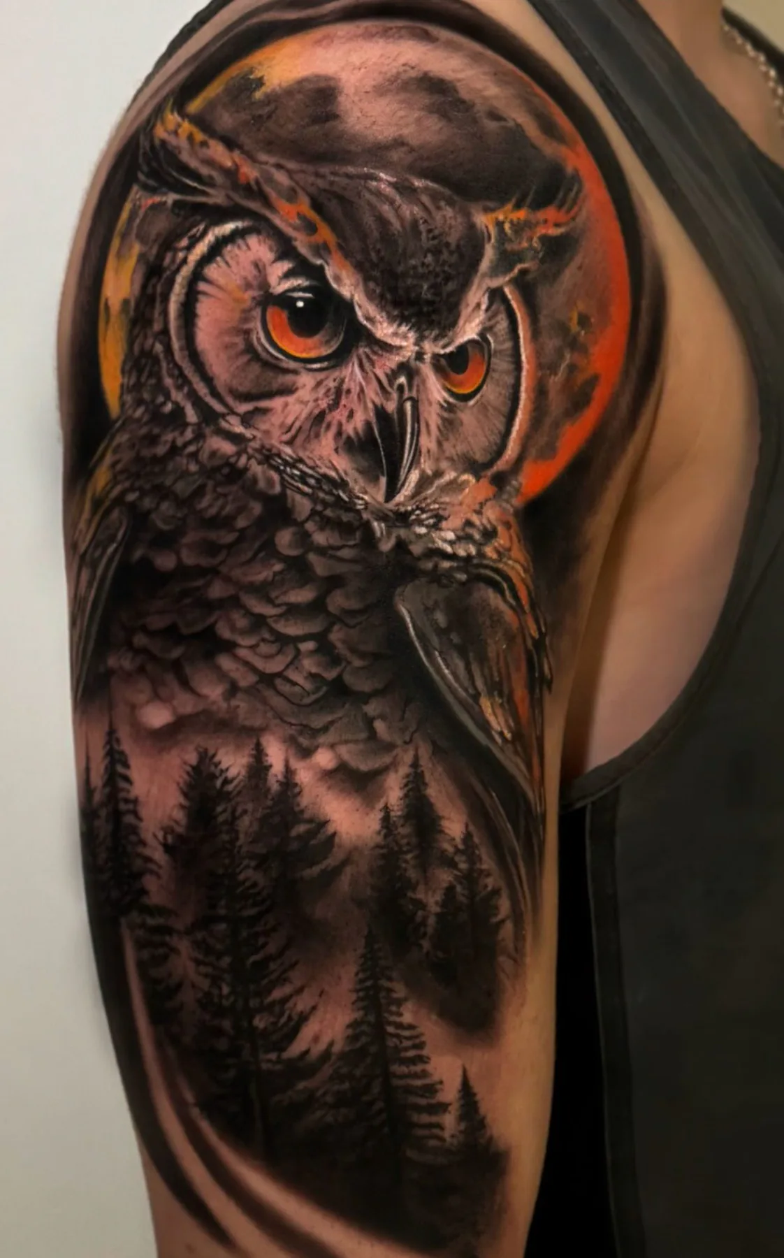 Owl with orange eyes. Tattoo at Ink21 in Vienna.