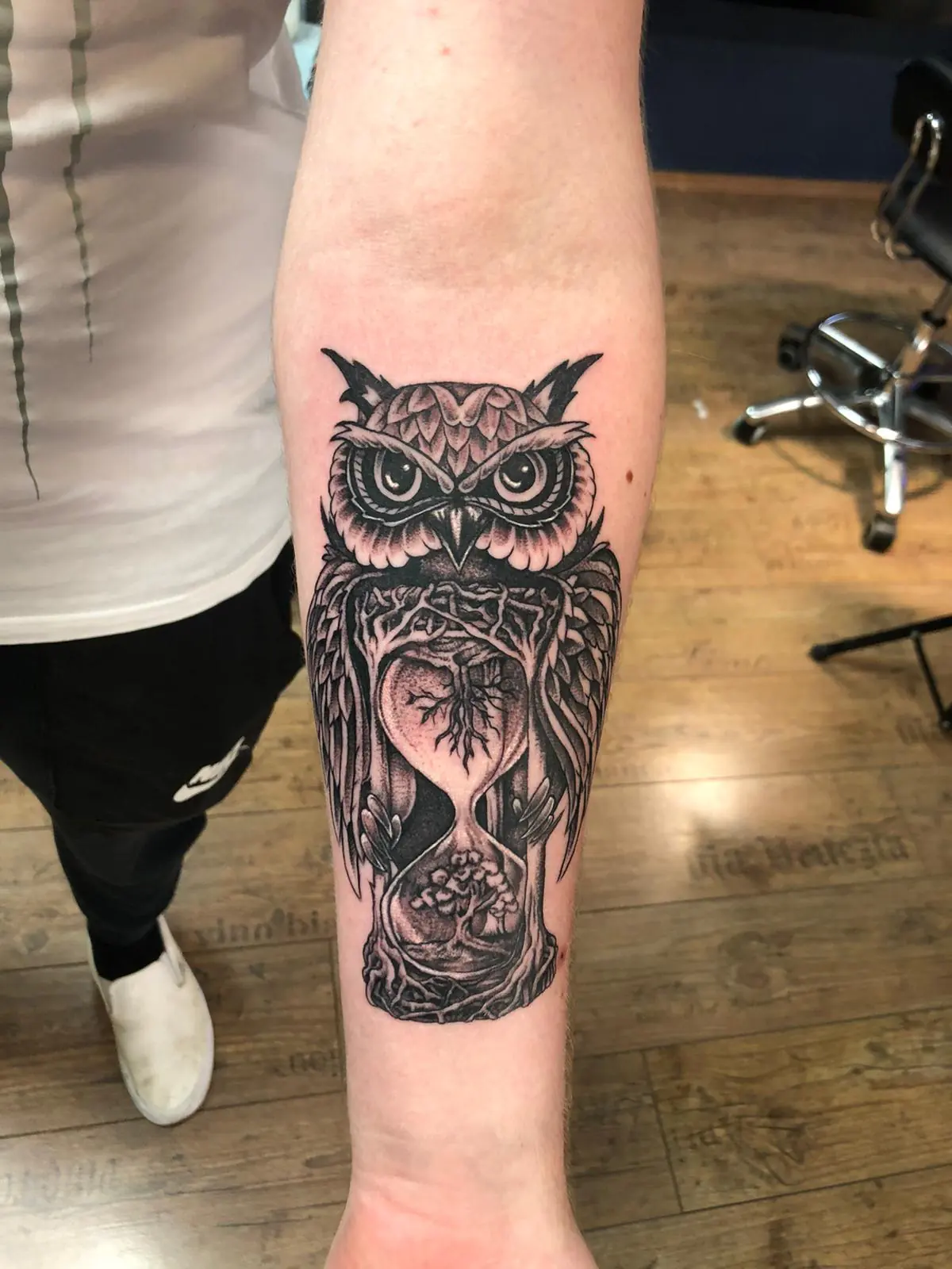 Owl above an hourglass. Tattoo at Ink21 in Vienna.