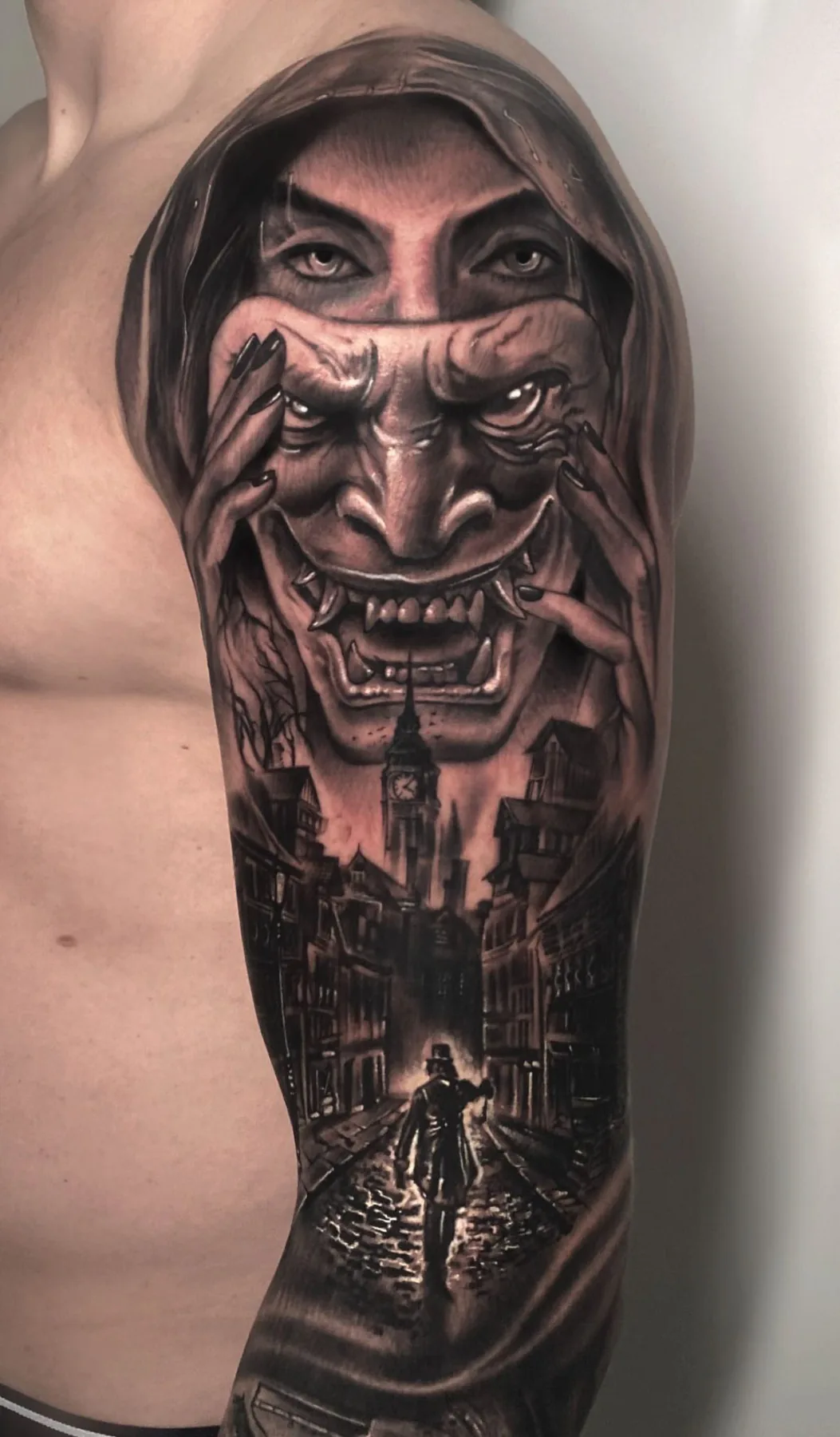 Woman with a mask above a city scene. Tattoo at Ink21 in Vienna.