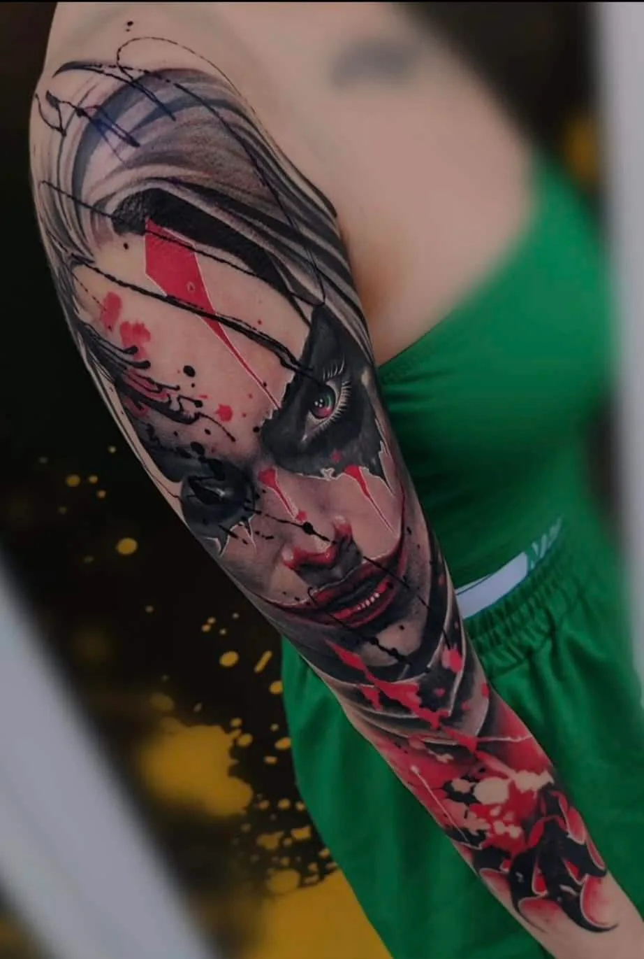 Woman’s portrait with red graphic shapes. Tattoo at Ink21 in Vienna.