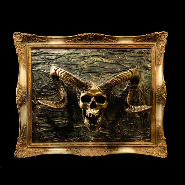 Horned skull in a gold frame. Artwork at Ink21 in Vienna.