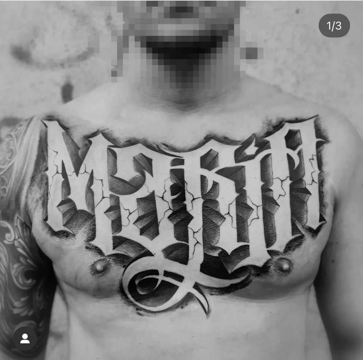 Large Gothic lettering across the chest. Tattoo at Ink21 in Vienna.