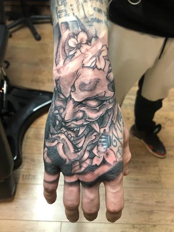 Hannya mask on the back of the hand. Tattoo at Ink21 in Vienna.