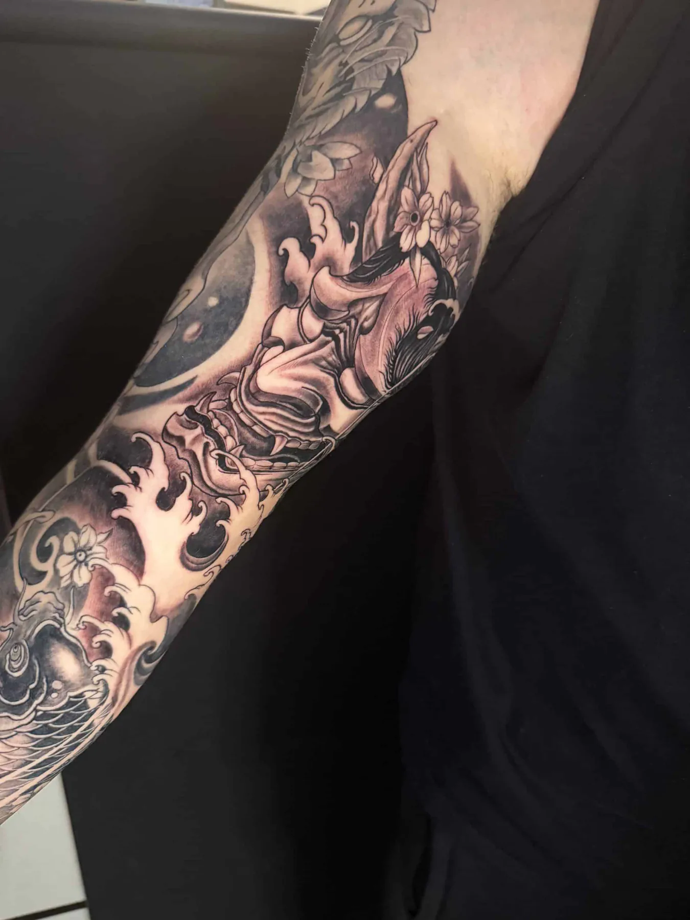 Hannya mask among waves. Tattoo at Ink21 in Vienna.