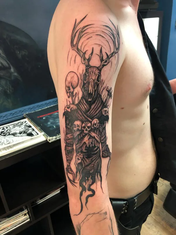 Deer skull and dark figures. Tattoo at Ink21 in Vienna.