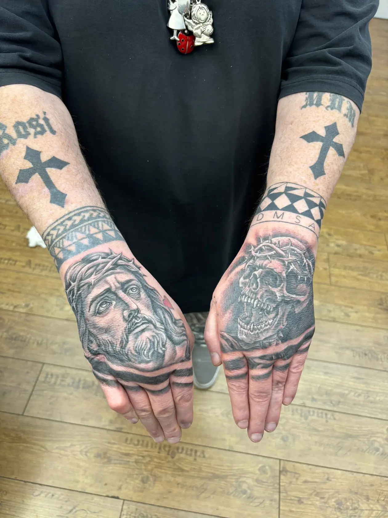 Jesus and skull hand tattoos. Tattoo at Ink21 in Vienna.