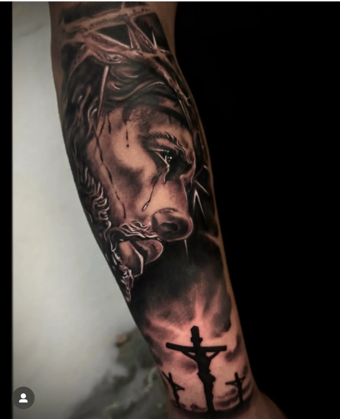 Portrait of Jesus above a cross. Tattoo at Ink21 in Vienna.