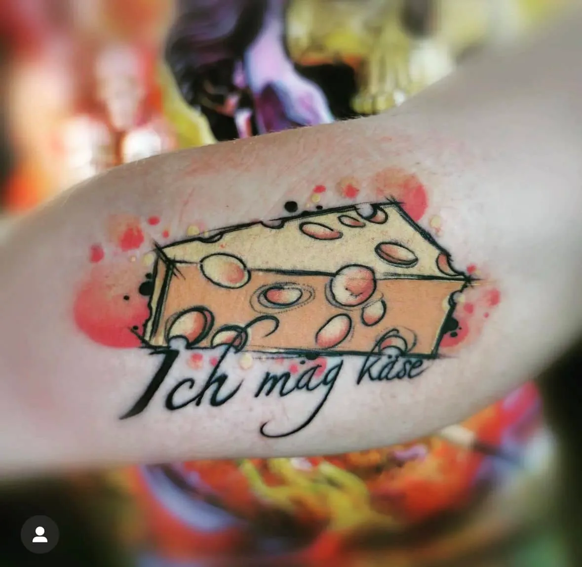 Cheese wedge with German lettering. Tattoo at Ink21 in Vienna.