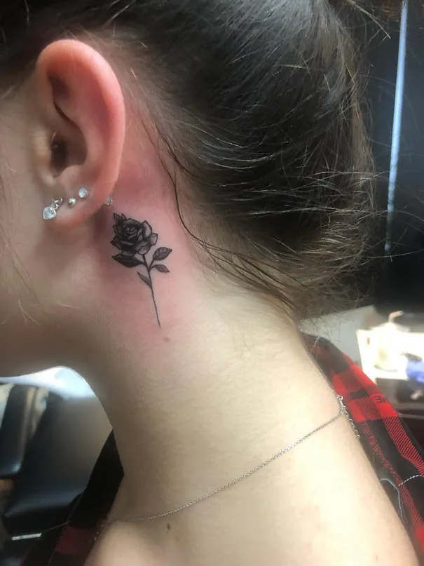 Small rose behind the ear. Tattoo at Ink21 in Vienna.