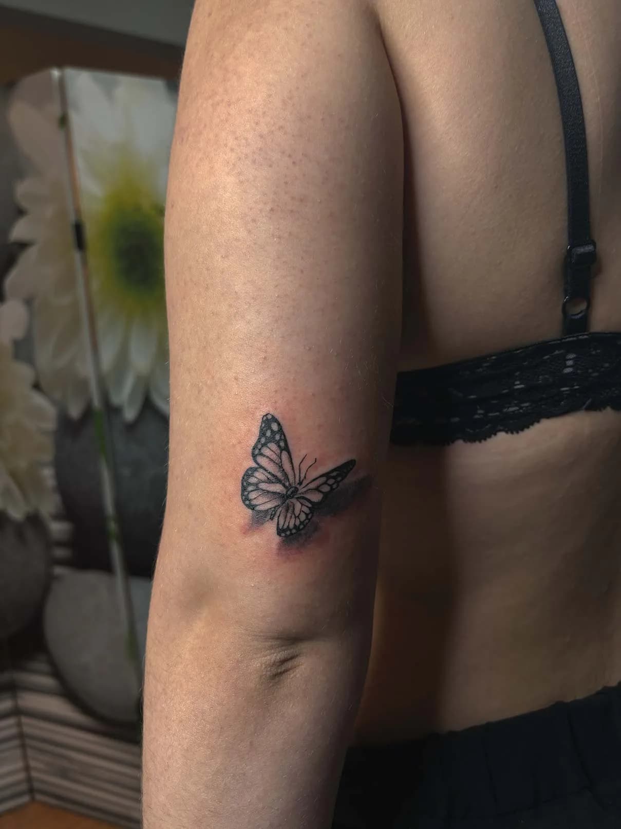 Small butterfly above the elbow. Tattoo at Ink21 in Vienna.