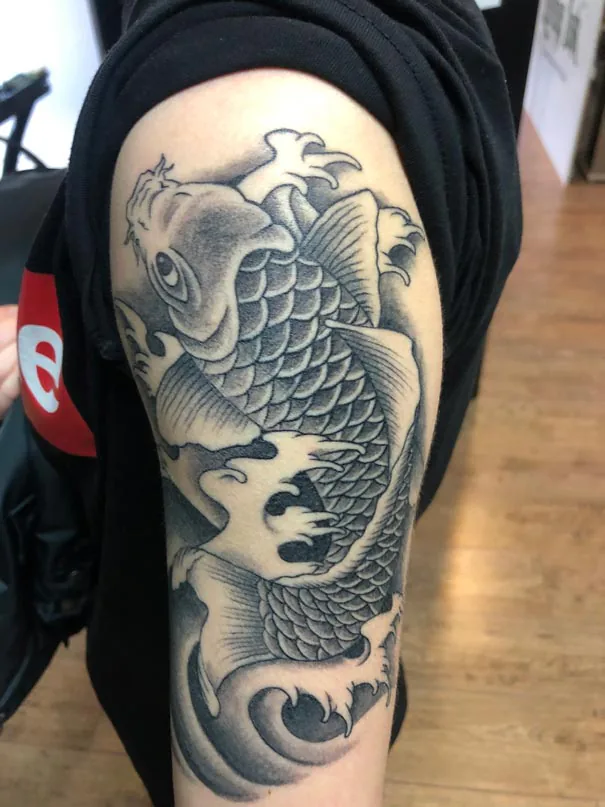 Koi among waves. Tattoo at Ink21 in Vienna.