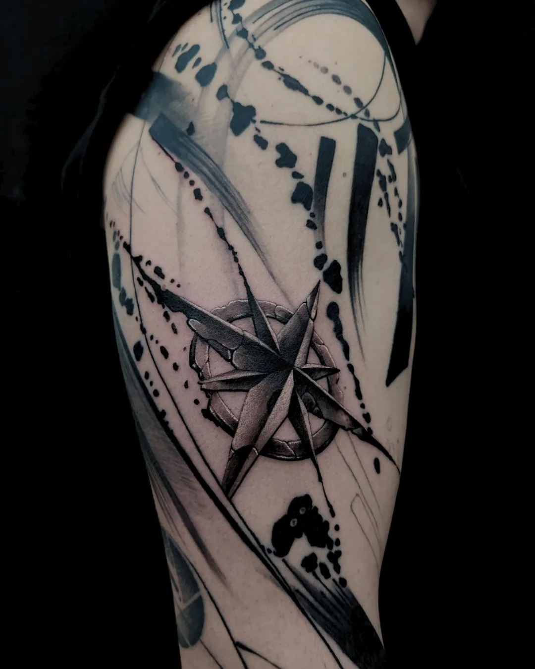 Compass with abstract black lines. Tattoo at Ink21 in Vienna.