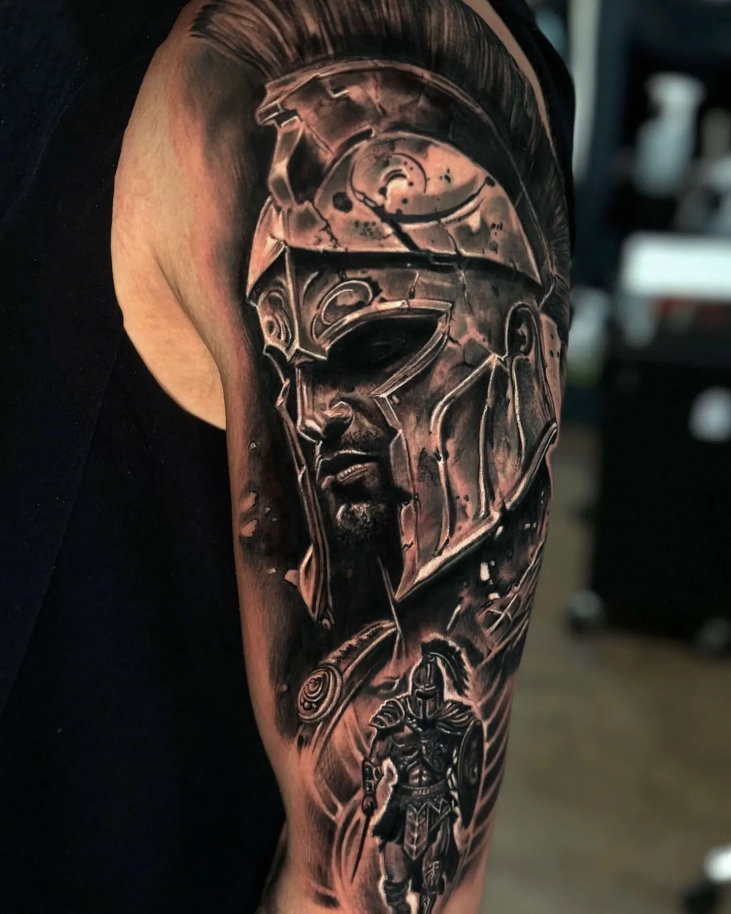 Warrior helmet on the upper arm. Tattoo at Ink21 in Vienna.