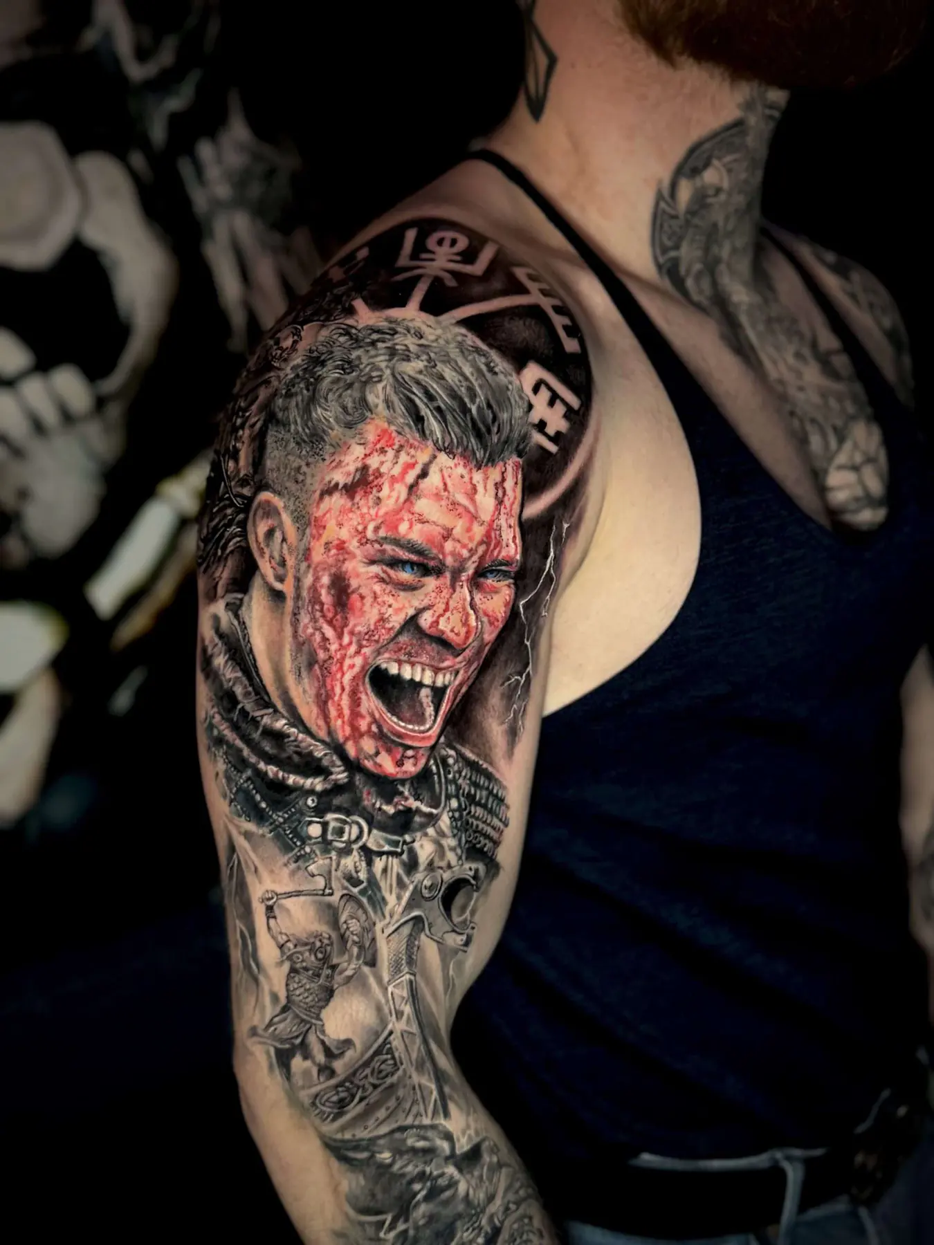Warrior portrait with red facial marks. Tattoo at Ink21 in Vienna.