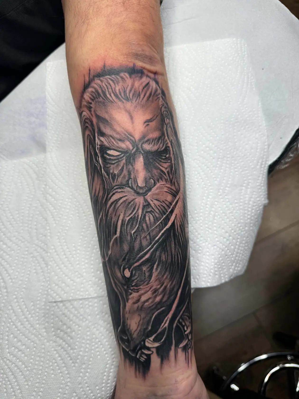 Long bearded face on the forearm. Tattoo at Ink21 in Vienna.