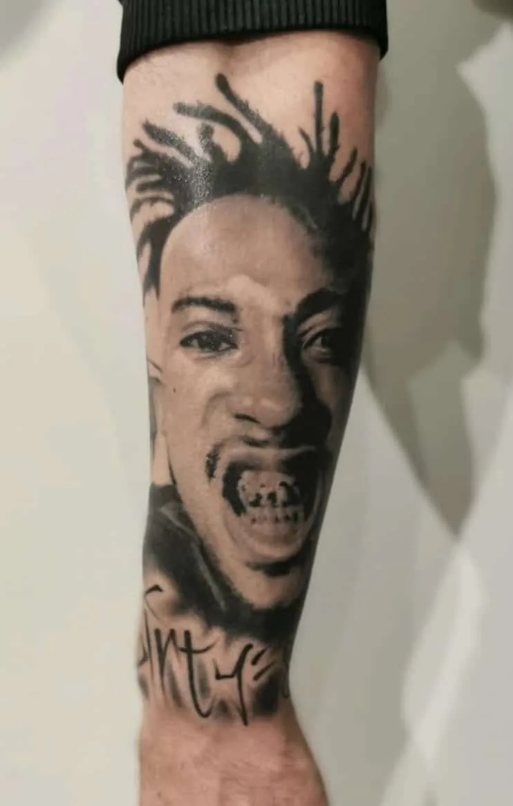 Man’s portrait with short textured hair. Tattoo at Ink21 in Vienna.