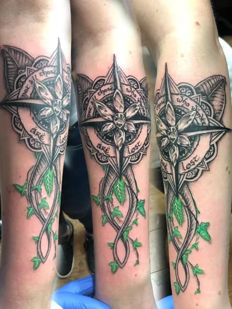 Ornamental compass with leafy ribbons. Tattoo at Ink21 in Vienna.