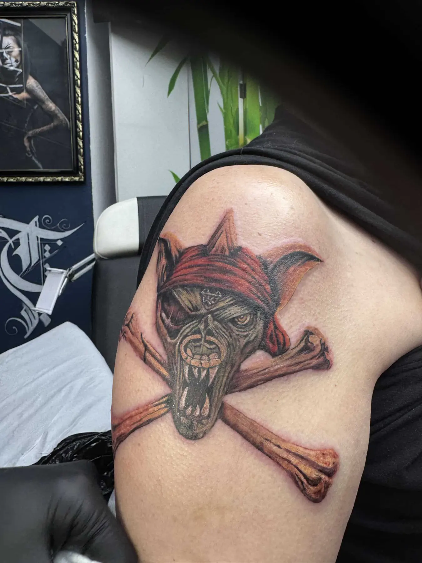 Pirate monkey with a red bandana. Tattoo at Ink21 in Vienna.