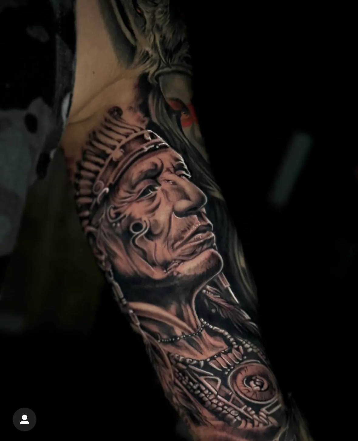 Portrait wearing a feathered headdress. Tattoo at Ink21 in Vienna.