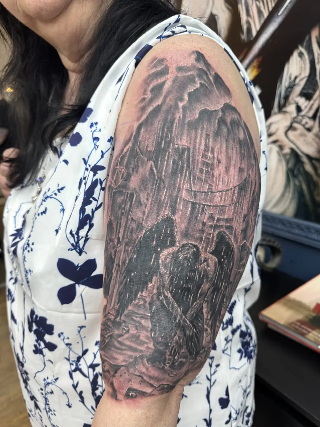 Raven against a rocky landscape. Tattoo at Ink21 in Vienna.