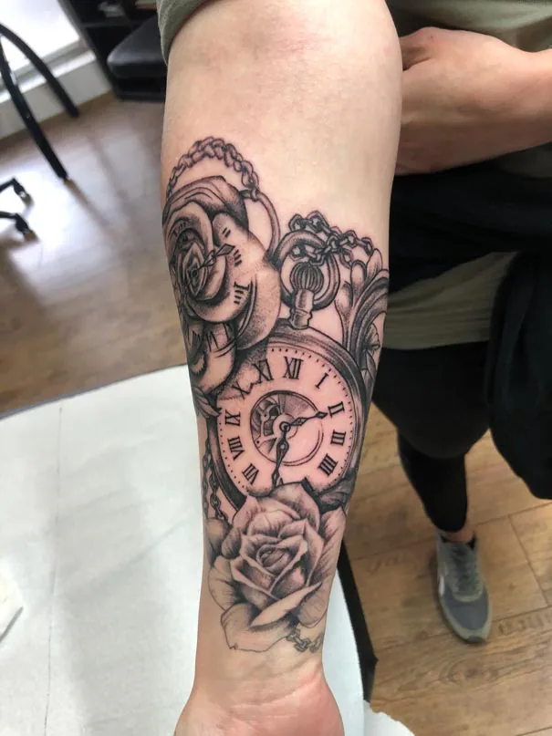 Rose and pocket watch close-up. Tattoo at Ink21 in Vienna.