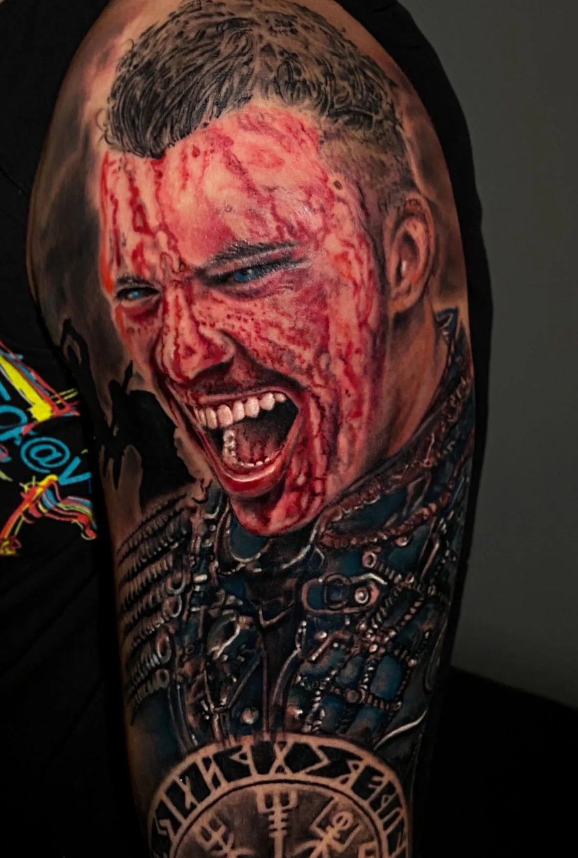 Warrior’s face with red markings. Tattoo at Ink21 in Vienna.