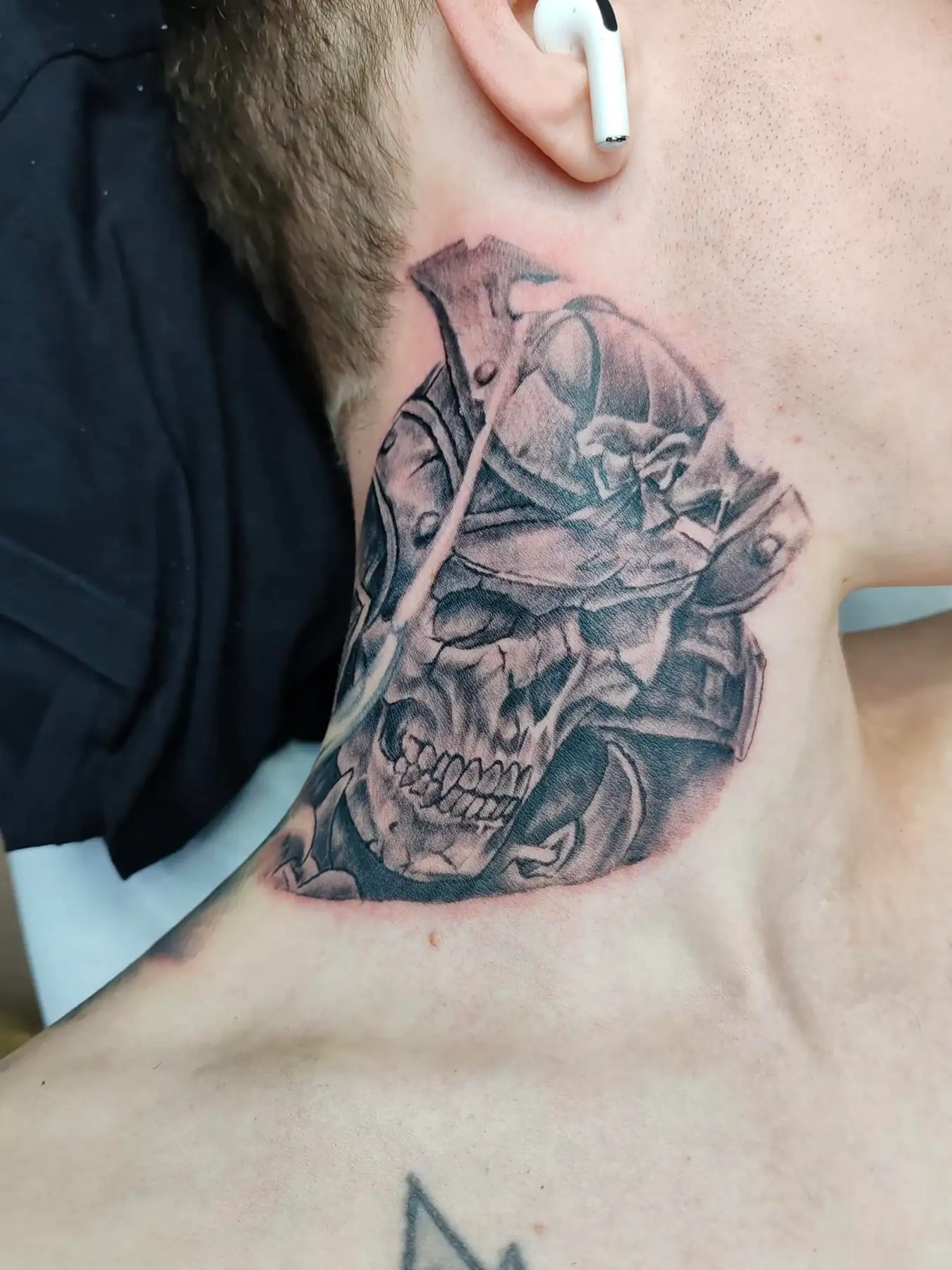 Samurai skull on the side of the neck. Tattoo at Ink21 in Vienna.