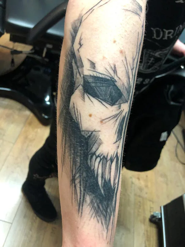 Skull with angular eye sockets. Tattoo at Ink21 in Vienna.