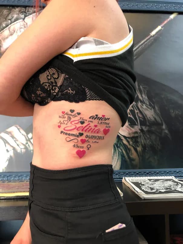 Lettering and red hearts on the side. Tattoo at Ink21 in Vienna.