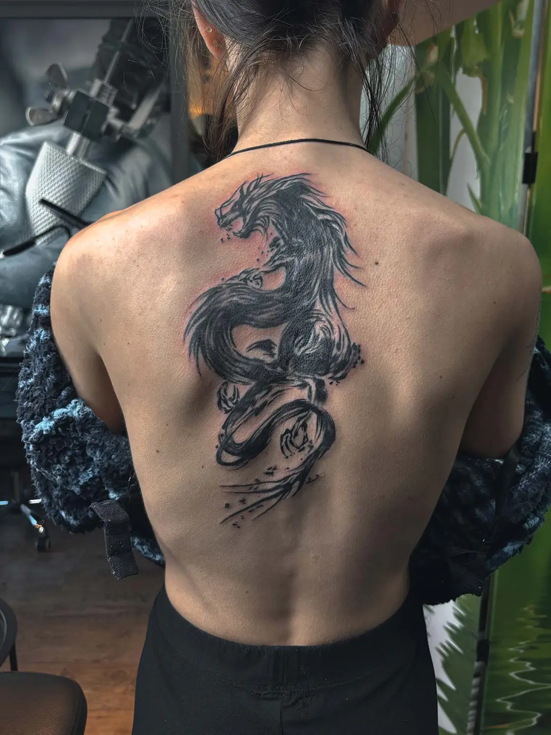 Black dragon along the back. Tattoo at Ink21 in Vienna.