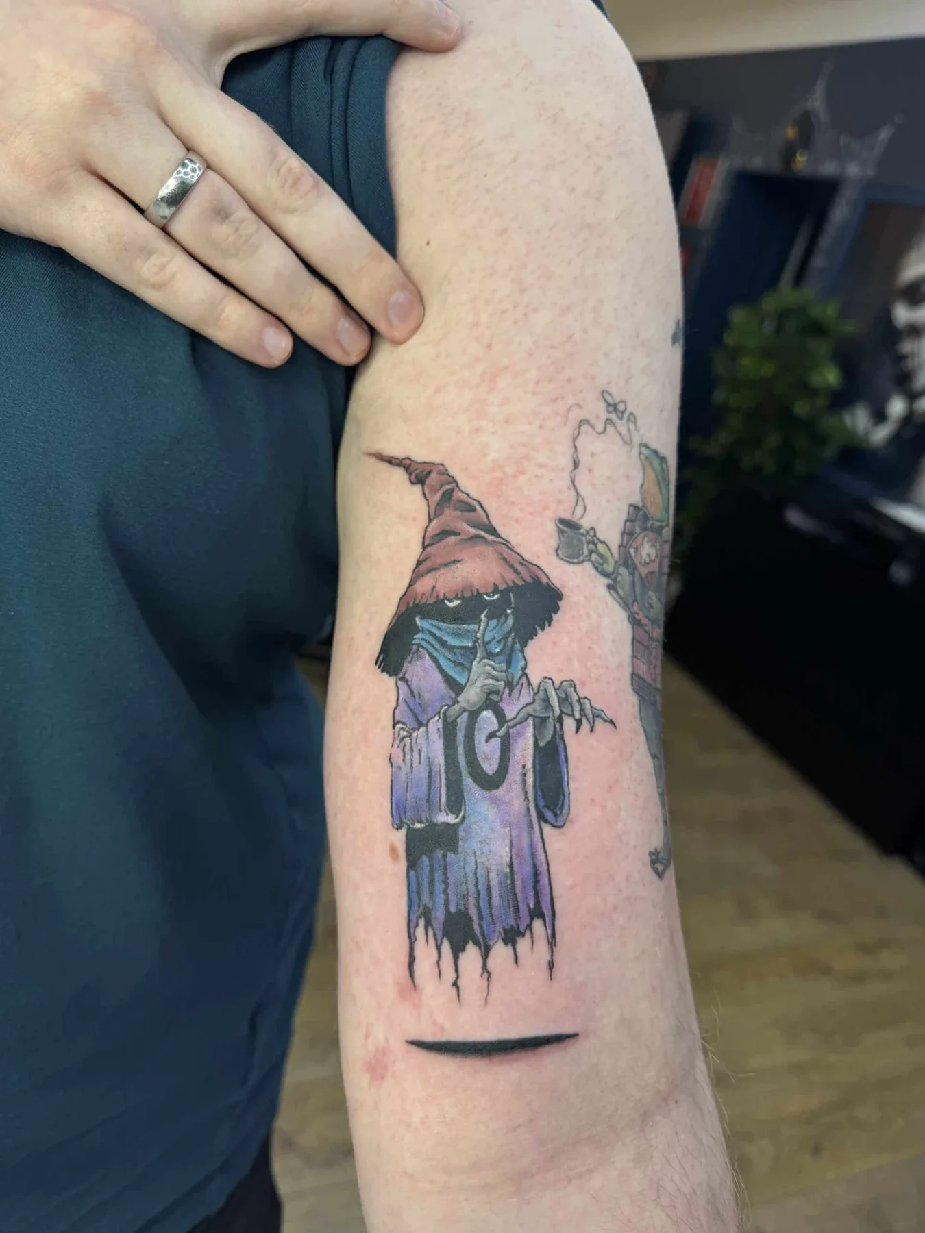 Floating figure in a purple cloak. Tattoo at Ink21 in Vienna.