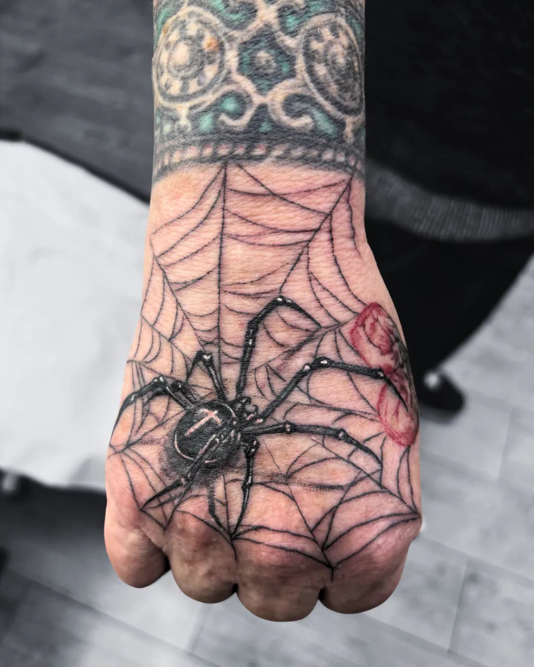 Spider web on the hand. Tattoo at Ink21 in Vienna.