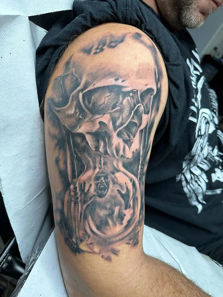 Skull with a circular watch design. Tattoo at Ink21 in Vienna.