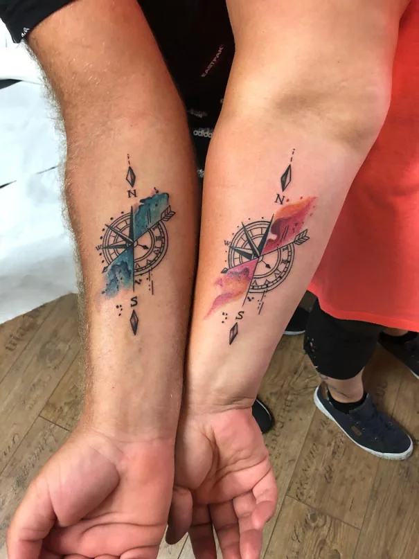 Two compass tattoos with colour accents. Tattoo at Ink21 in Vienna.