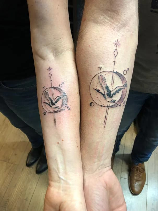 Two bird designs with fine symbols. Tattoo at Ink21 in Vienna.